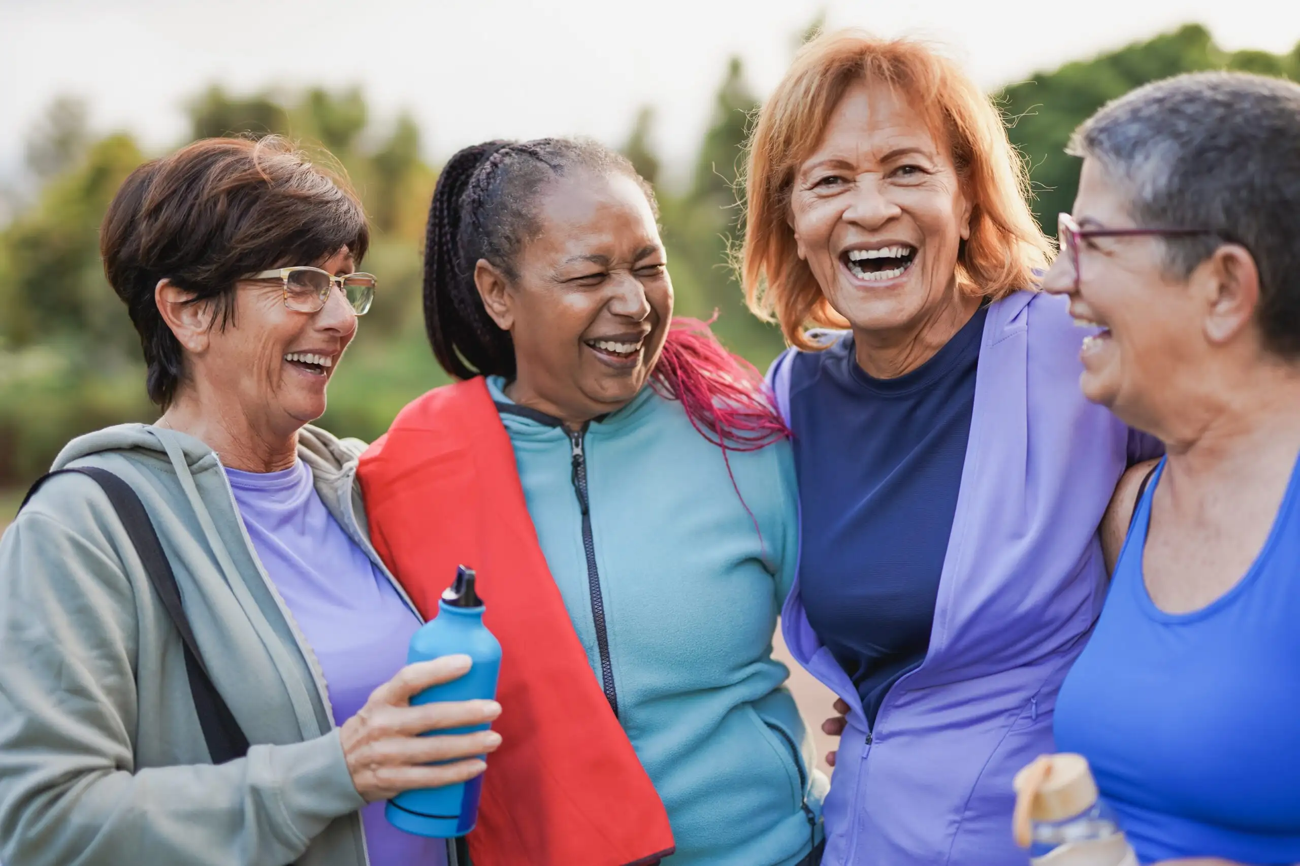 Happy multiracial senior women having fun together after sport workout at city park - Joyful elderly female friends and healthy lifestyle concept Happy multiracial senior women having fun together after sport workout at city park - Joyful elderly female friends and healthy lifestyle concept